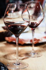 Red wine and snacks. Shallow depth of field.