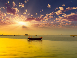 Beautiful sunset with fishing boat