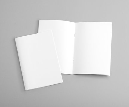 Blank brochure on grey background.