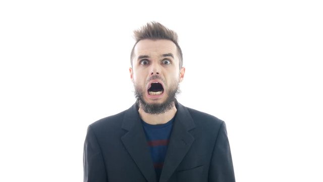 Furious angry bearded man in suit going mad and pointing at you, studio isolated on white background.
