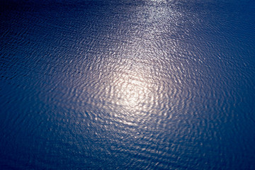 Abstract blur sun reflection on the water in the lake