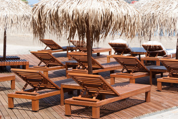 beach lounge chairs umbrella