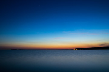 Summer sea sunset with waves