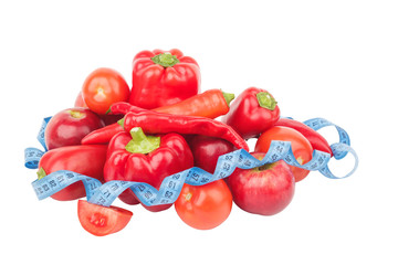 Diet concept: Set from red bell pepper, red hot chili pepper and apple with measuring tape