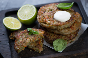 Closeup of fried vegetable cutlets with broccoli, selective focus, studio shot