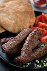 Close-up of bbq cevapi or cevapcici sausages, selective focus, shallow depth of field
