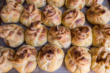 Fresh pastries on a baking sheet