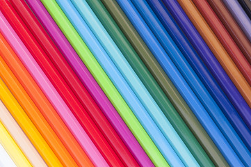 Ready to get creative! Shot of some color pencils layout on a desk.