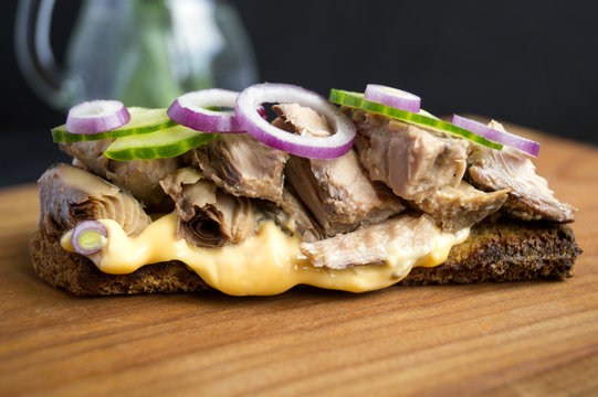 Healthy Sandwich With Tuna, Cucumber And Sauce. On A Wooden Board. Black Background