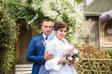 Bride and groom at wedding Day Outdoors. Bridal couple, Loving wedding couple outdoor. Bride and groom