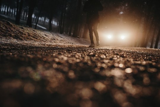 Man walking in headlight