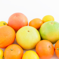 Citrus fruits - lemon, mandarin, orange and grapefruit on white background. Flat lay, top view.