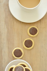 butter biscuits topping chocolate cream and coffee cup