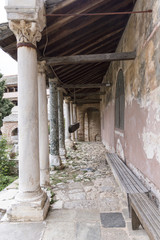 Old stone columns at a monastery on Holy Athos Mountain, Greece; spring time