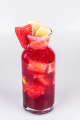 Strawberry lemonade carafe on isolated white background