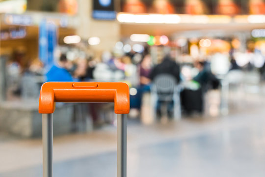 Orange suitcase handle close up