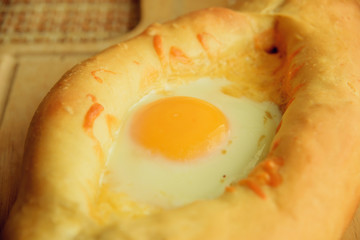 Khachapuri in Adjara with the egg. The Georgian cuisine.
