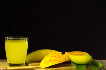 Mango juice on black background