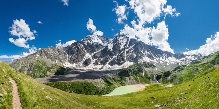 Panoramic view of Donguzorun lake and Mt. Donguzorun and Nakra from Cheget slope in summer sunny day