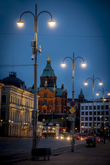 Night descends on Helsinki street with Uspenski Cathedral in background