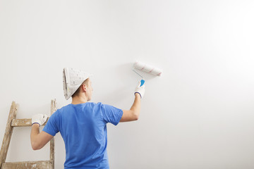  the painter whitewashed the wall of the room. © ballabeyla