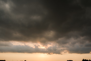 black sky Background of dark clouds before a thunder.
sunlight through very dark clouds background of dark storm clouds