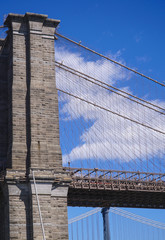 Obraz premium Ancient Brooklyn Bridge New York - an iconic landmark- MANHATTAN / NEW YORK - APRIL 1, 2017