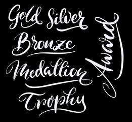 Trophy and medallion hand written typography. Good use for logotype, symbol, cover label, product, brand, poster title or any graphic design you want. Easy to use or change color
 