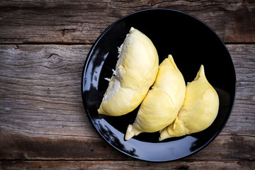 Durian on Black plate. Top view. Tropical fruit. King of fruit.