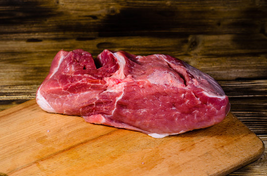 Raw pork meat on cutting board