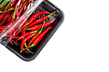 Red chili in foam and plastic package
