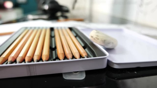 Open box of drawing pencils