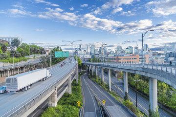 Highway with traffic and semi truck running through Seattle