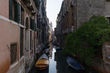 Obraz na płótnie Canvas A small canal with venetian buildings reflected, Venice, Italy