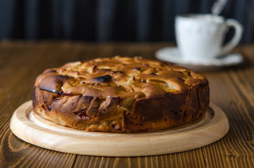 Apple vegan pie with coffee and snowdrops
