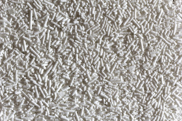 White sugar sticks in the form of a background