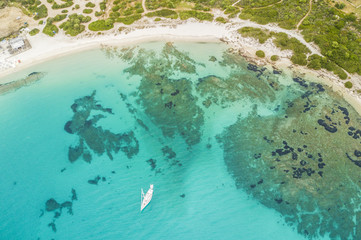 Naklejka na ściany i meble Aerial view of the Sardinian Emerald Coast, with its turquoise sea. Costa Smeralda in Sardinia Island, is one of the most beautiful and famous coasts in the world
