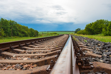 Rails. nature. overcast sky