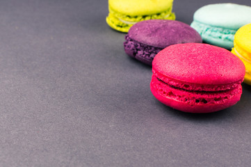 Colourful french macaroons on the grey background