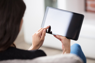 Woman Looking At Digital Tablet