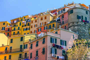 Fototapeta na wymiar View of some houses of the famous town of Manarola inside the Cinque Terre National Park.