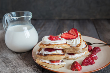 pancake in the shape of a heart with strawberries