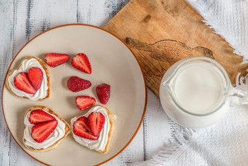 pancake in the shape of a heart with strawberries