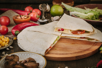 Nice vegetarian quesadilla with tortilla bread, beans, cheese and vegetables.