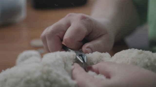 Process of creating a soft handmade toy. Work details: craft toy in the old-fashioned style. Teddy bear as in the 20th century - fashionable collectible toys. Beige teddy bear: process of creation.