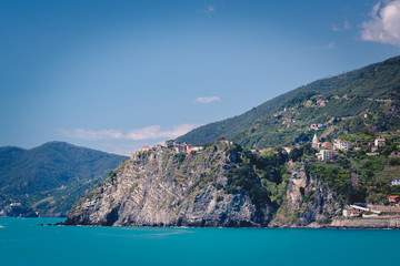 Scenic view of the mediterrean sea and a town inside the Cinque Terre National Park, Liguria, Italy from the cliffs near Manarola.