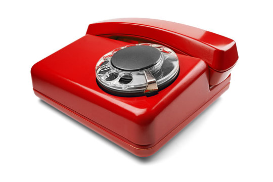 Landline red phone on isolated background with a shadow