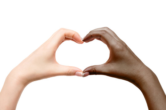 Female hands show heart on white background.