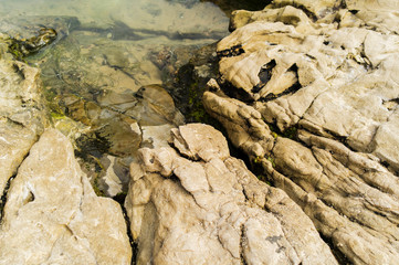 Rocks in a shallow water.
