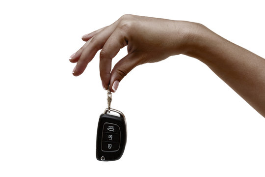 African female hand holds car keys.